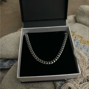sterling silver chain, about 22 inches with extension.